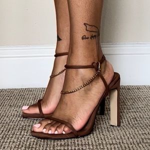 Chocolate brown two strap heels with gold chain.
